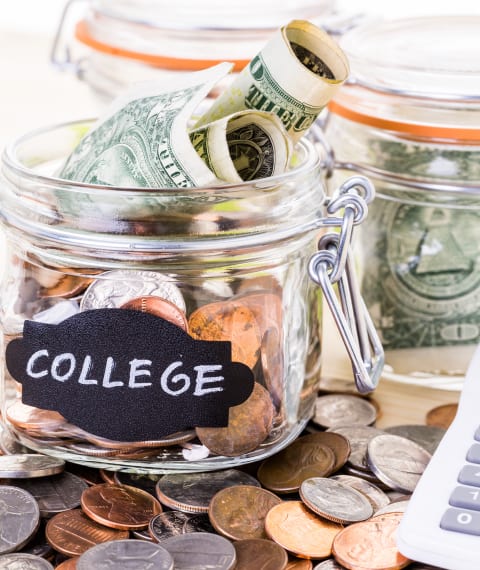 Image of a jar full of money with a sign saying college