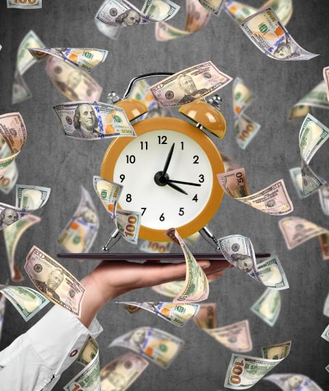 Image of a person holding a plate with a clock on it with money falling down around it